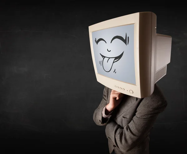 Hombre de negocios feliz con un monitor de computadora y una cara sonriente — Foto de Stock