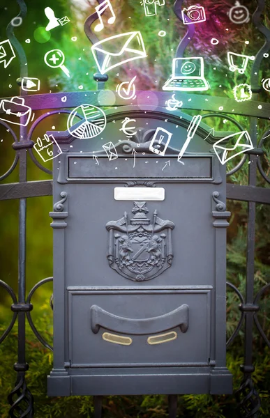 Colorful icons and symbols bursting out of a mailbox — Stock Photo, Image