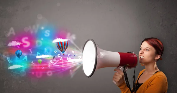 Girl shouting into megaphone and abstract text and balloons come — Stock Photo, Image