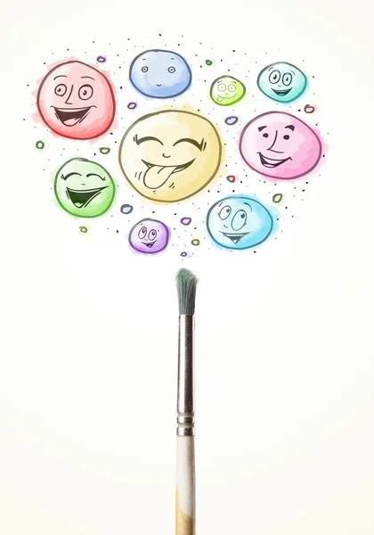 Smiley faces coming out of paintbrush — Stock Photo, Image