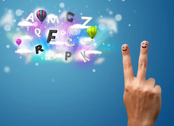 Happy smiley fingers looking at colorful magical clouds and ball — Stock Photo, Image