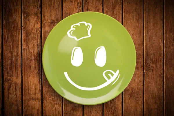 Happy smiley cartoon gezicht op kleurrijke schotel — Stockfoto