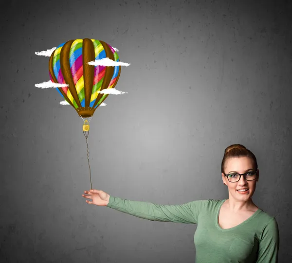 Woman holding a balloon drawing — Stock Photo, Image