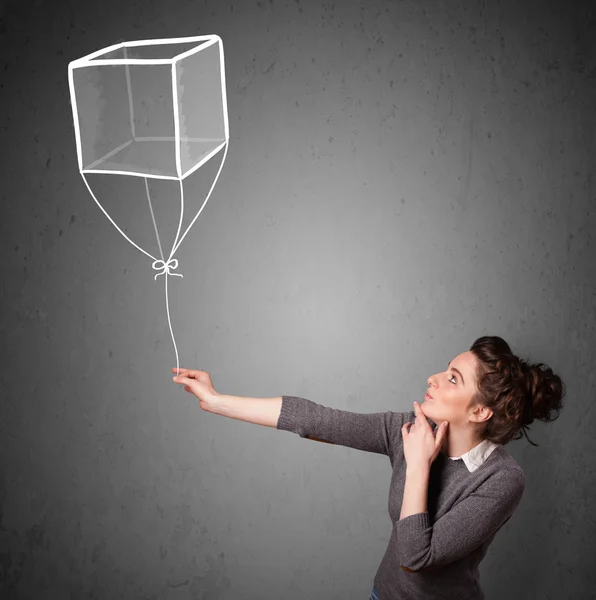 Γυναίκα που κρατά ένα μπαλόνι κύβος — Φωτογραφία Αρχείου