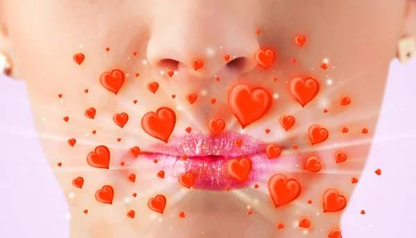 Pretty lady lips with lovely red hearts — Stock Photo, Image