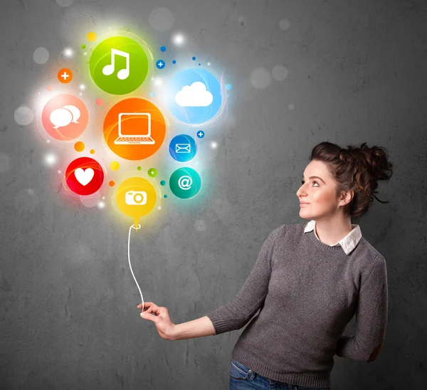 Woman holding social media balloon — Stock Photo, Image