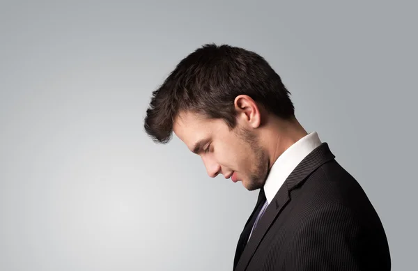 Young businessman thinking with copyspace — Stock Photo, Image