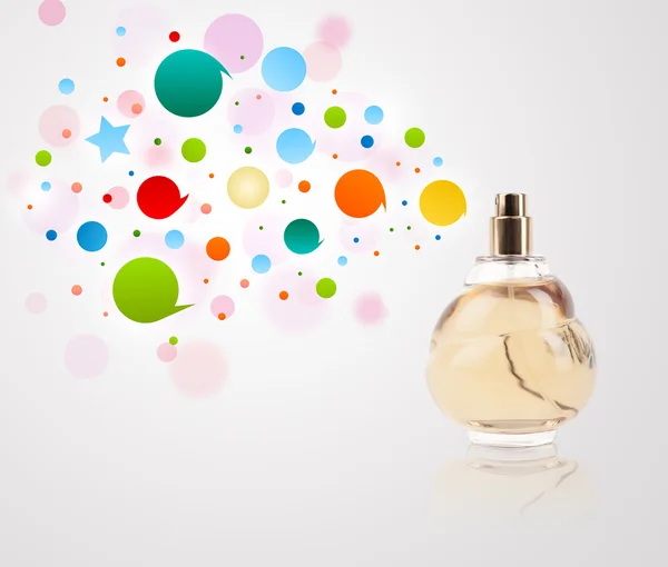 Perfume bottle spraying colored bubbles — Stock Photo, Image