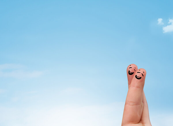 Happy smiley fingers looking at clear blue sky copyspace