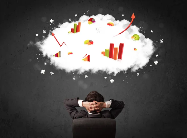 Businessman with charts in a cloud above his head — Stock Photo, Image