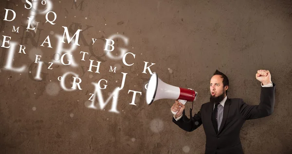 Man in shirt shouting into megaphone and text come out — Stock Photo, Image