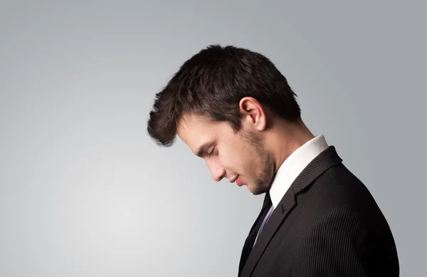 Young businessman thinking with copyspace Stock Picture