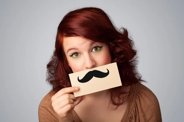 Menina bonito feliz segurando papel com desenho de bigode — Fotografia de Stock