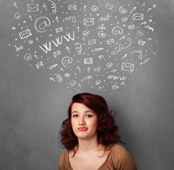 Young woman thinking with social network icons above her head — Stock Photo, Image