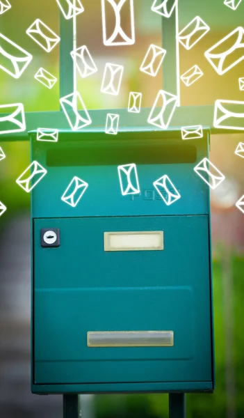 Mailbox with letter icons on glowing green background — Stock Photo, Image