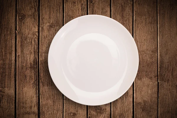 Colorido plato vacío en la mesa de fondo grueso —  Fotos de Stock