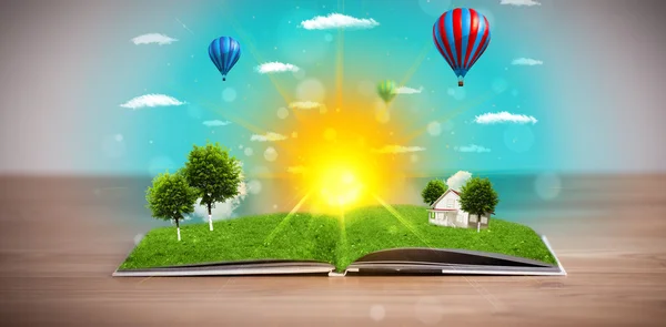 Open book with green nature world coming out of its pages — Stock Photo, Image