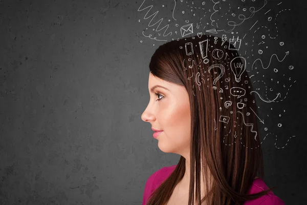 Menina pensando com ícones abstratos na cabeça — Fotografia de Stock