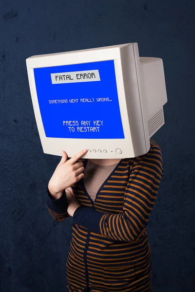 Person with a monitor head and fatal error blue screen on the di — Stock Photo, Image