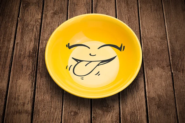 Happy smiley cartoon face on colorful dish plate — Stock Photo, Image