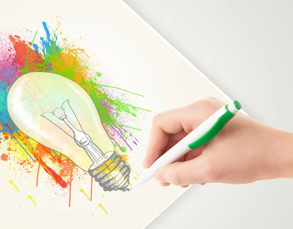 Hand drawing colorful idea light bulb with a pen — Stock Photo, Image