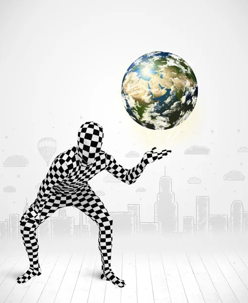 Man in full body suit holding planet earth — Stock Photo, Image