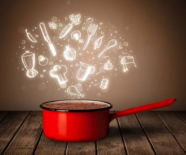 Cooking icons coming out from cooking pot — Stock Photo, Image