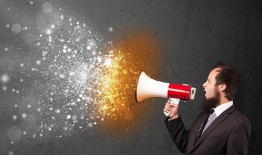 Guy shouting into megaphone and glowing energy particles explode clipart