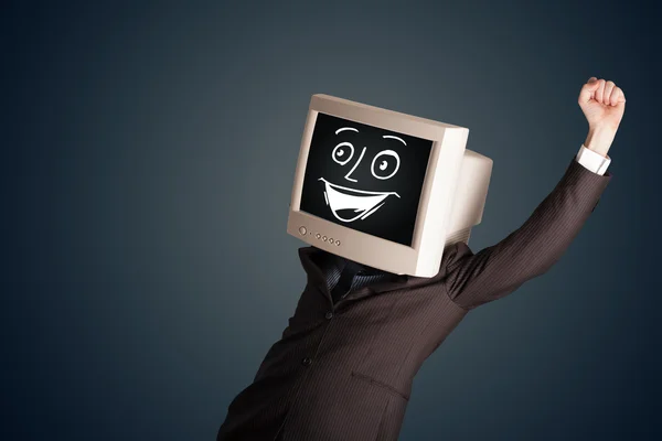 Happy businessman with a PC monitor head and a smiley face — Stock Photo, Image