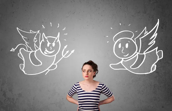 Woman standing between the angel and the devil — Stock Photo, Image