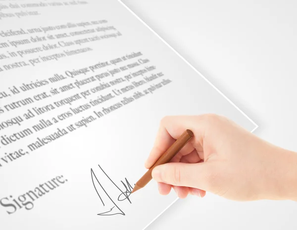 Hand writing personal signature on a paper form — Stock Photo, Image