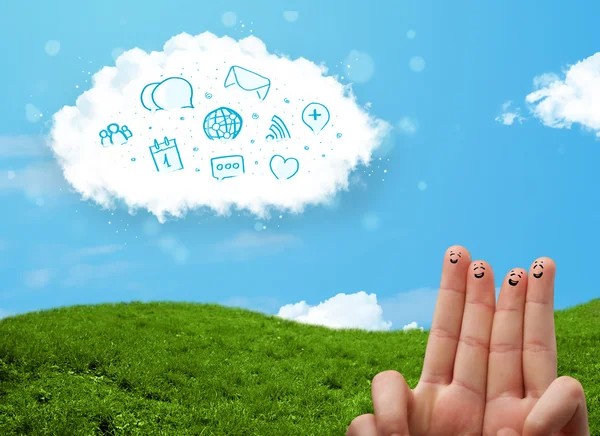 Happy smiley fingers looking at cloud with blue social icons and — Stock Photo, Image