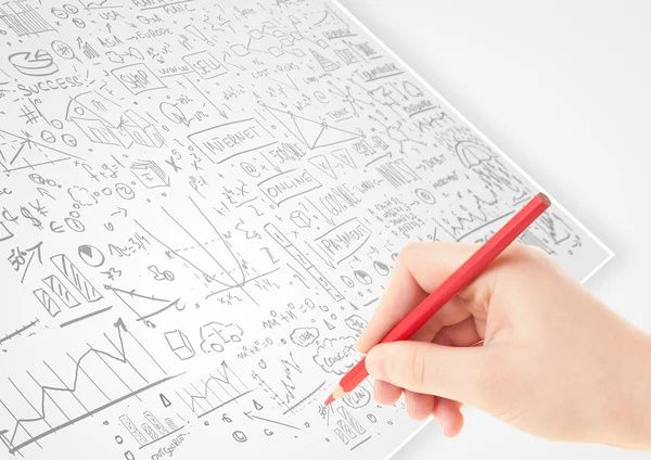 Human hand sketching ideas on a white paper — Stock Photo, Image