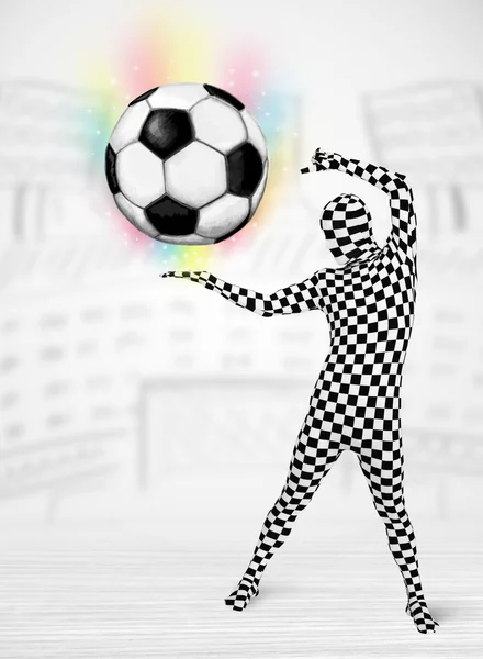 Man in full body suit holdig soccer ball — Stock Photo, Image