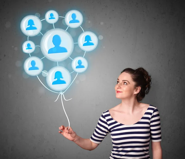 Woman holding social network balloon — Stock Photo, Image