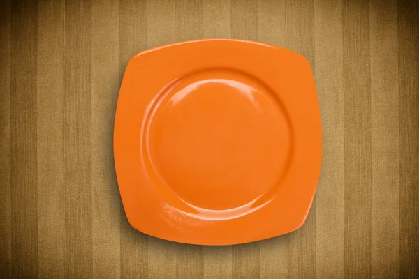 Assiette vide colorée sur table de fond grungy — Photo