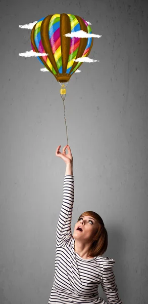 Woman holding a balloon drawing — Stock Photo, Image