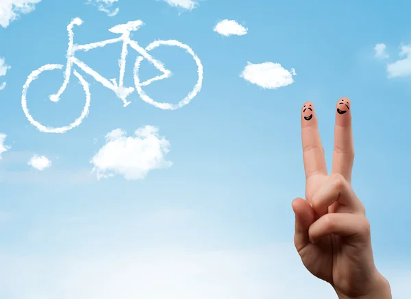 Happy smiley fingers looking at a bicycle shapeed cloud — Stock Photo, Image