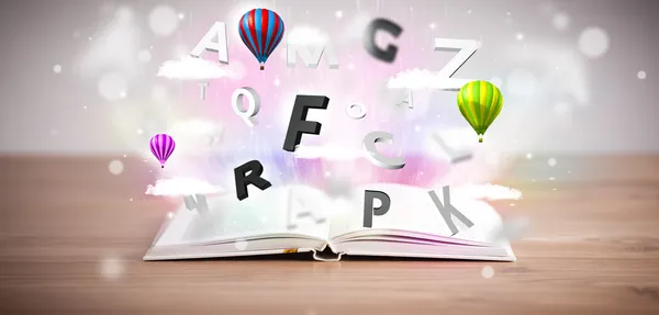 Öppen bok med flygande 3D bokstäver på konkret bakgrund — Stockfoto