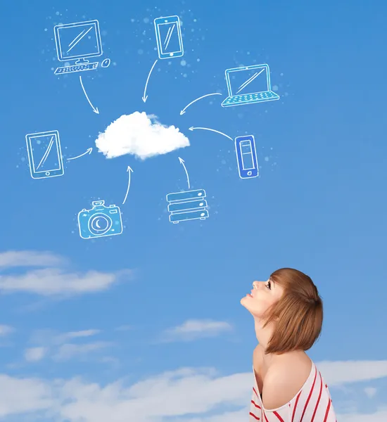 Casual girl looking at cloud computing concept on blue sky — Stock Photo, Image