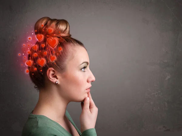 Young person thinking about love with red hearts — Stock Photo, Image