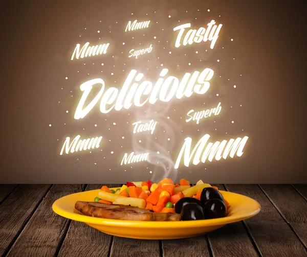 Food plate with delicious and tasty glowing writings — Stock Photo, Image