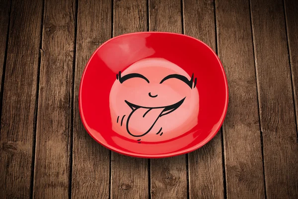 Šťastný smajlík kreslený obličej na barevném talíři — Stock fotografie