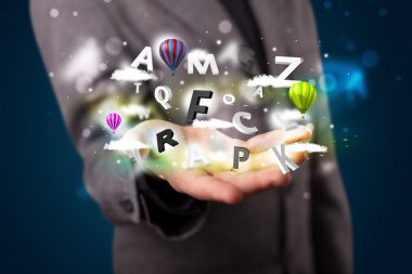 genç işadamı harfler ve bal ile sihirli bulutları sunulması