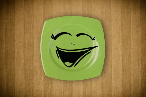 Happy smiley visage de dessin animé sur plaque de plat coloré — Photo