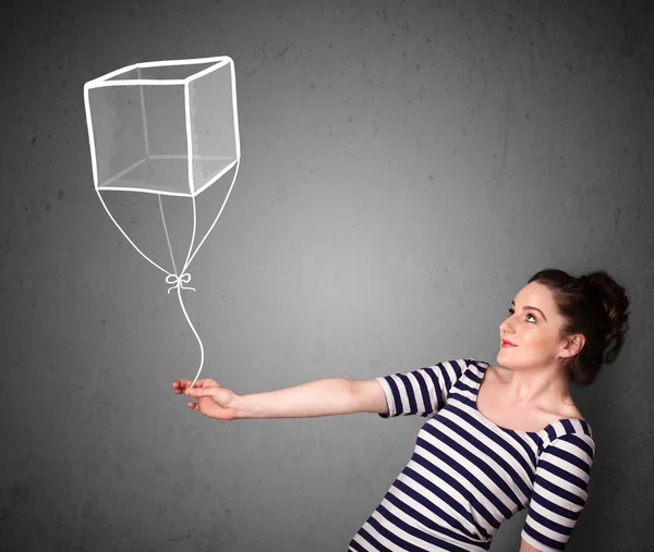 Mulher segurando um balão cubo — Fotografia de Stock