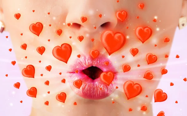 Pretty lady lips with lovely red hearts — Stock Photo, Image