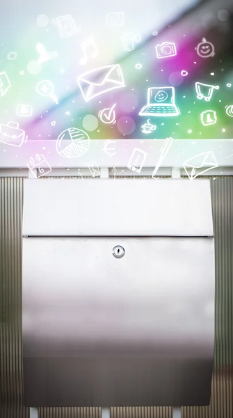 Colorful icons and symbols bursting out of a mailbox — Stock Photo, Image