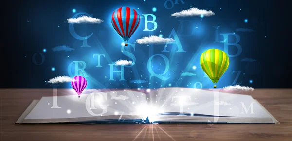 Open book with glowing fantasy abstract clouds and balloons — Stock Photo, Image