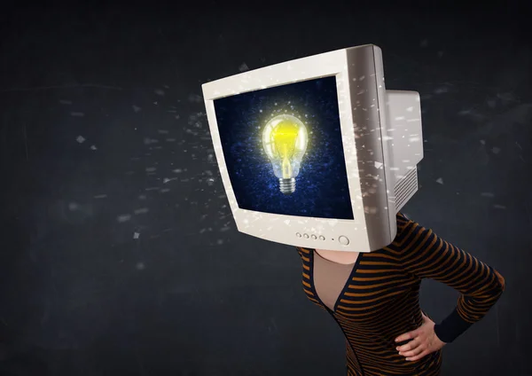 Young girl with a monitor head, idea light bulb on the display s — Stock Photo, Image